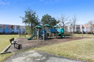 A playground with several different types of play equipment.