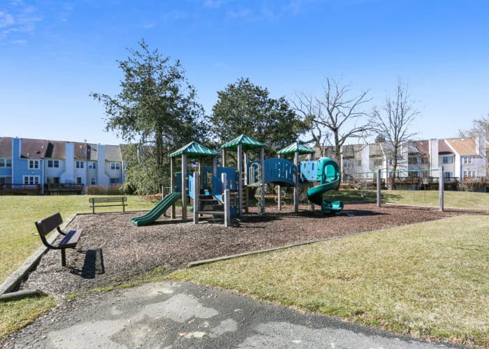 A playground with several different types of play equipment.