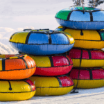 A bunch of snow tubes stacked on top of each other
