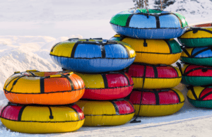 A bunch of snow tubes stacked on top of each other