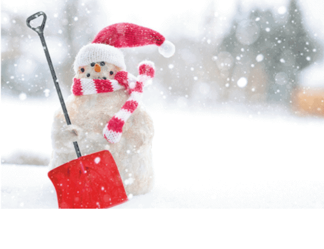 A snowman with a red hat and scarf holding a snow shovel.